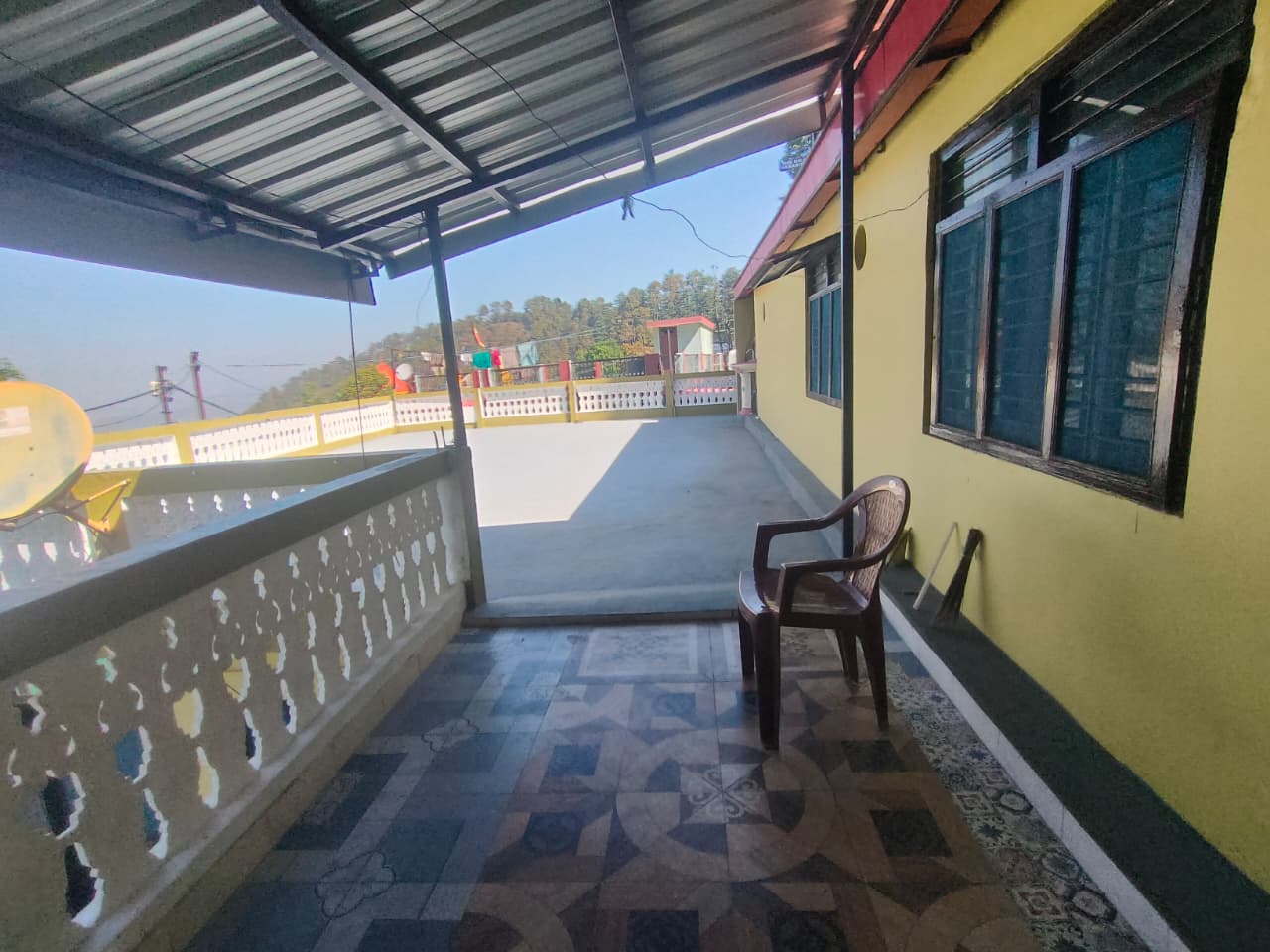 Rooftop terrace at Malti Home Stay with open sky views and seating area